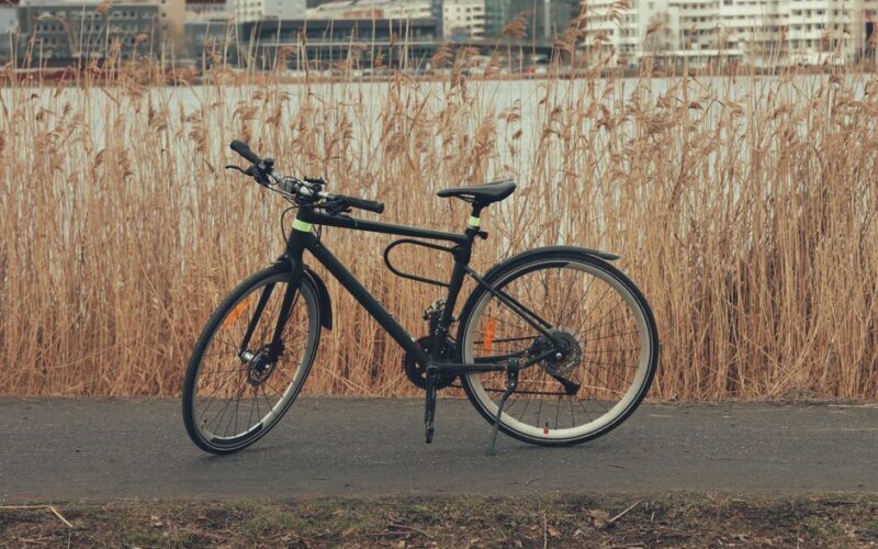Scenic view of a bicycle on a lakeside path in Jönköping, Sweden during fall.